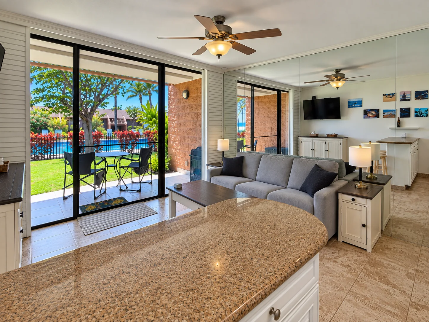 Kuleana 304 living room opening toward the lanai and pool